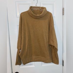 CY Boutique caramel turtleneck top. Size L